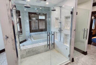 Stunning French Doors, with elegant, substantial, back-to-back ladder pulls with Rosettes, giving full access to the double shower, and a Fixed Glass Panel view for an open concept appearance. 
*Front View